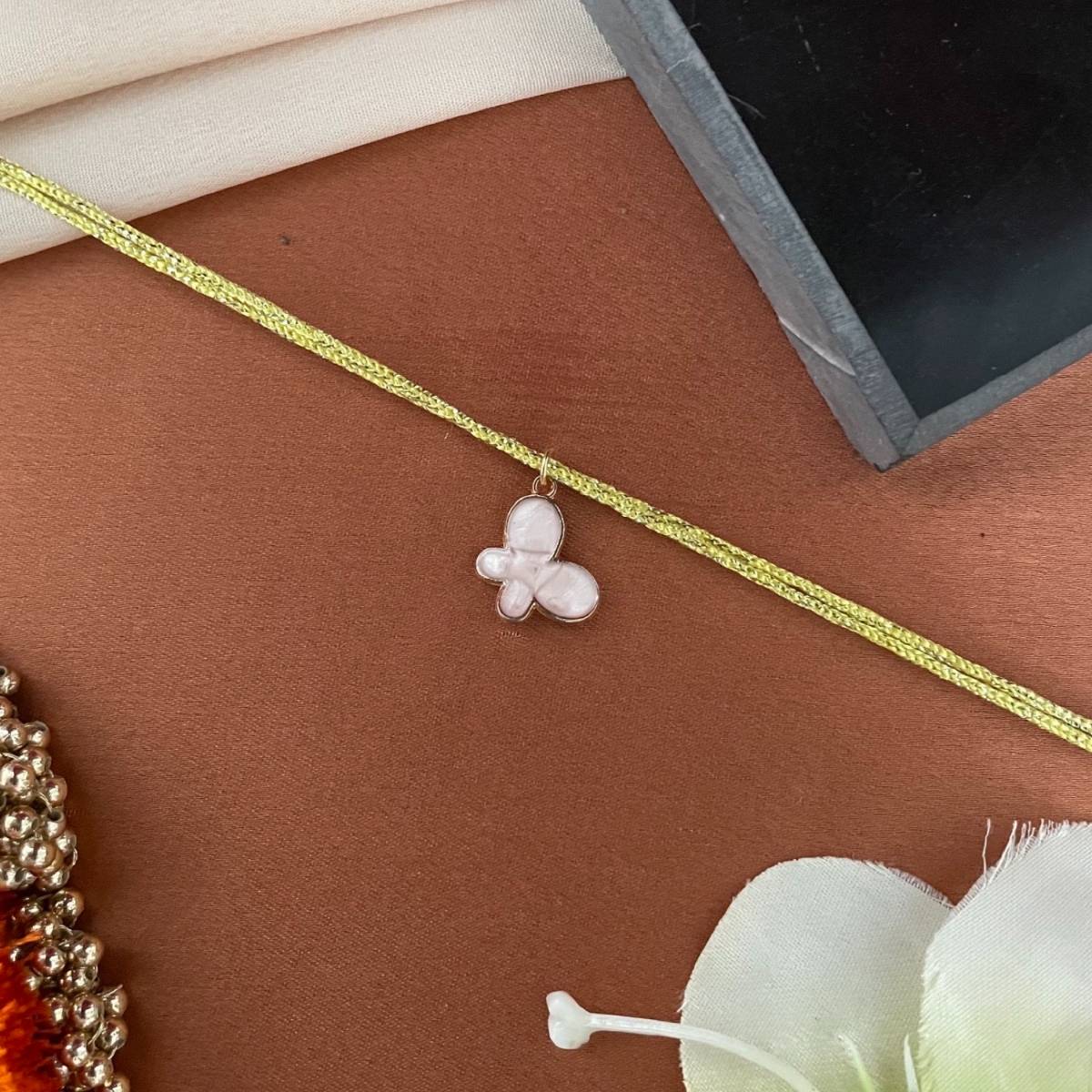 Digital Dress Room Gold Plated Pink Flower Charm Pendant Rakhi For Raksha Bandhan