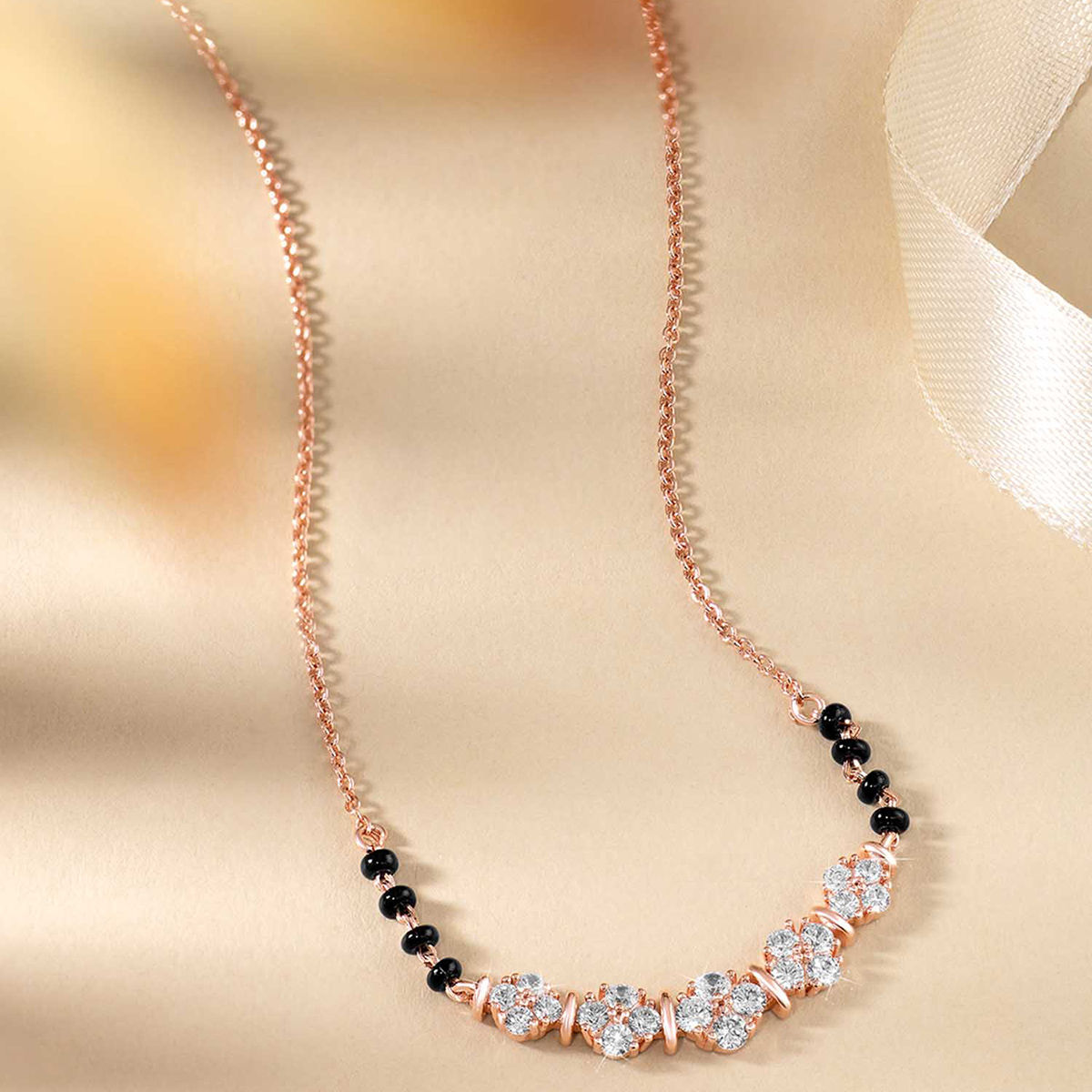 Buy Peora Rose Gold Plated Black Cubic Zirconia Mangalsutra Online