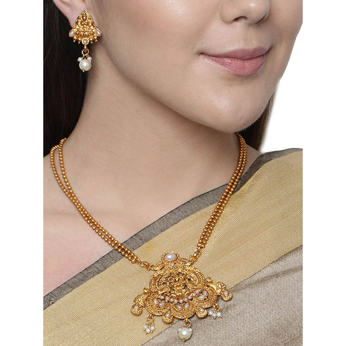 Anika's Creations Antique Matte Gold Finish White Stone Studded Temple Jewellery Set