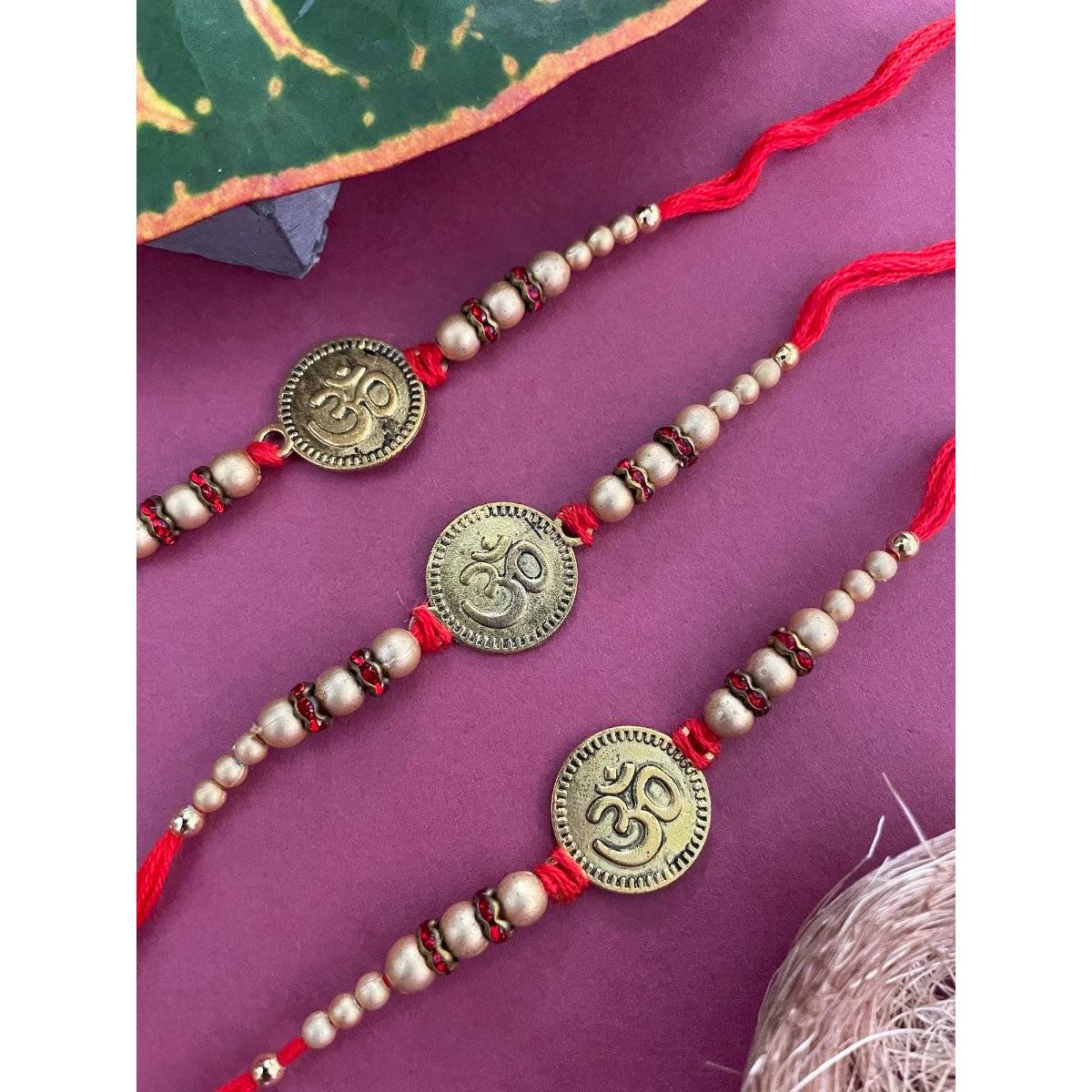 Digital Dress Room Multi-Color Om Coins Rakhi (Pack of 3)