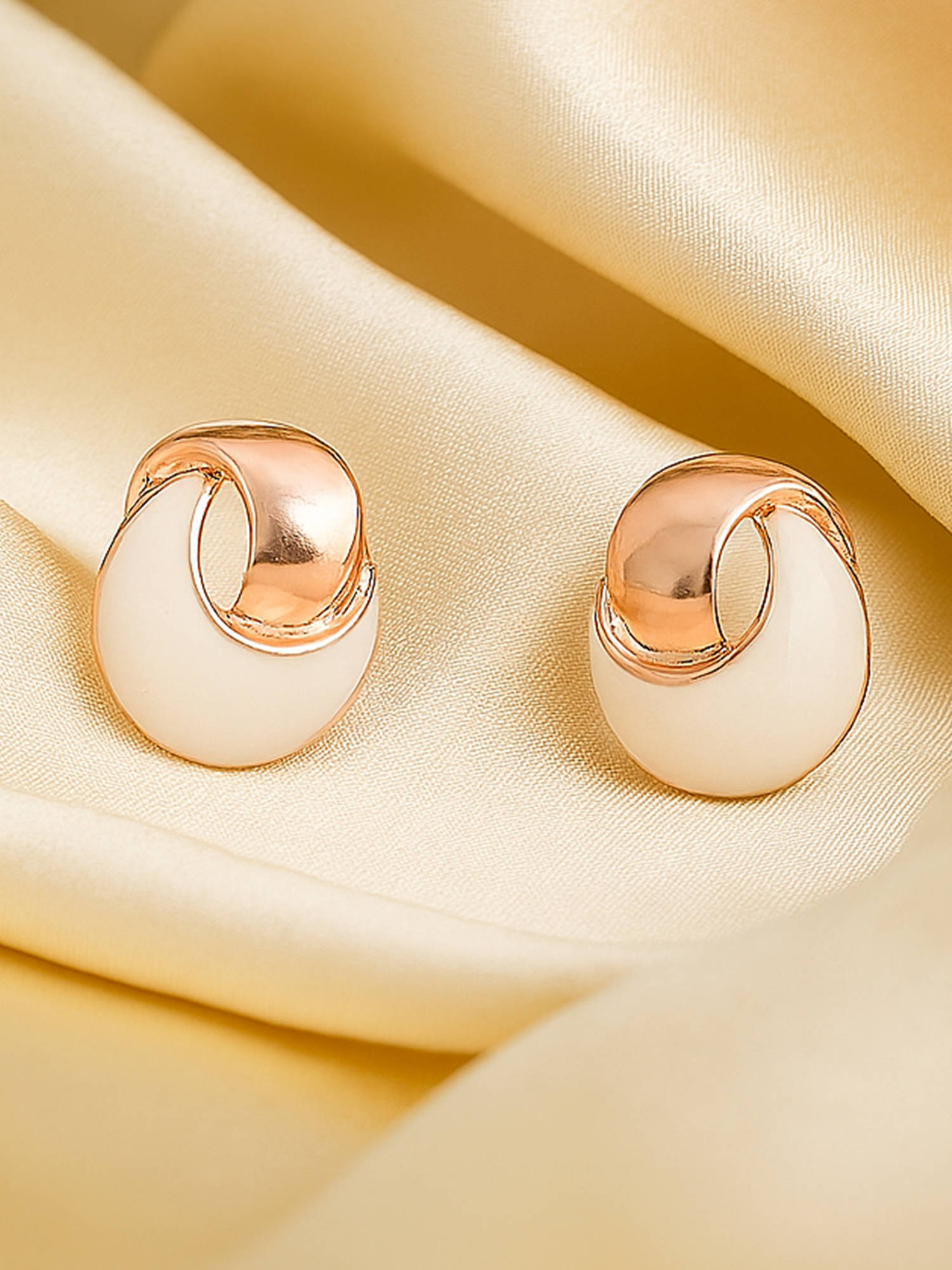 Estele Rose Gold plated swirl and dome designer stud earring for Women.