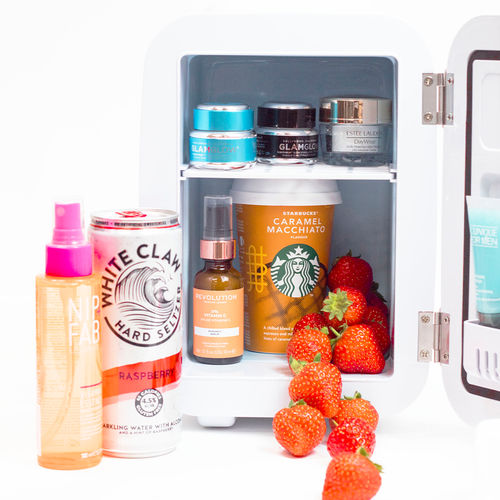 Premium Photo  Mini fridge with cosmetic products on white vanity table