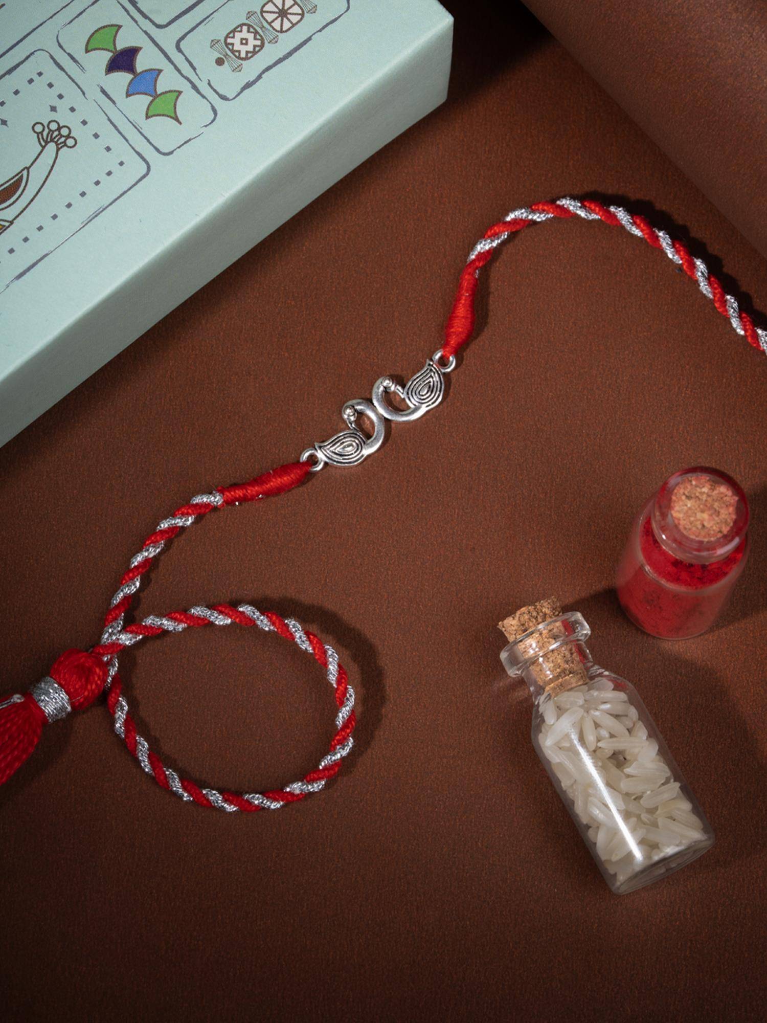 Shaya by CaratLane Pichwai Mayur 925 Silver Rakhi