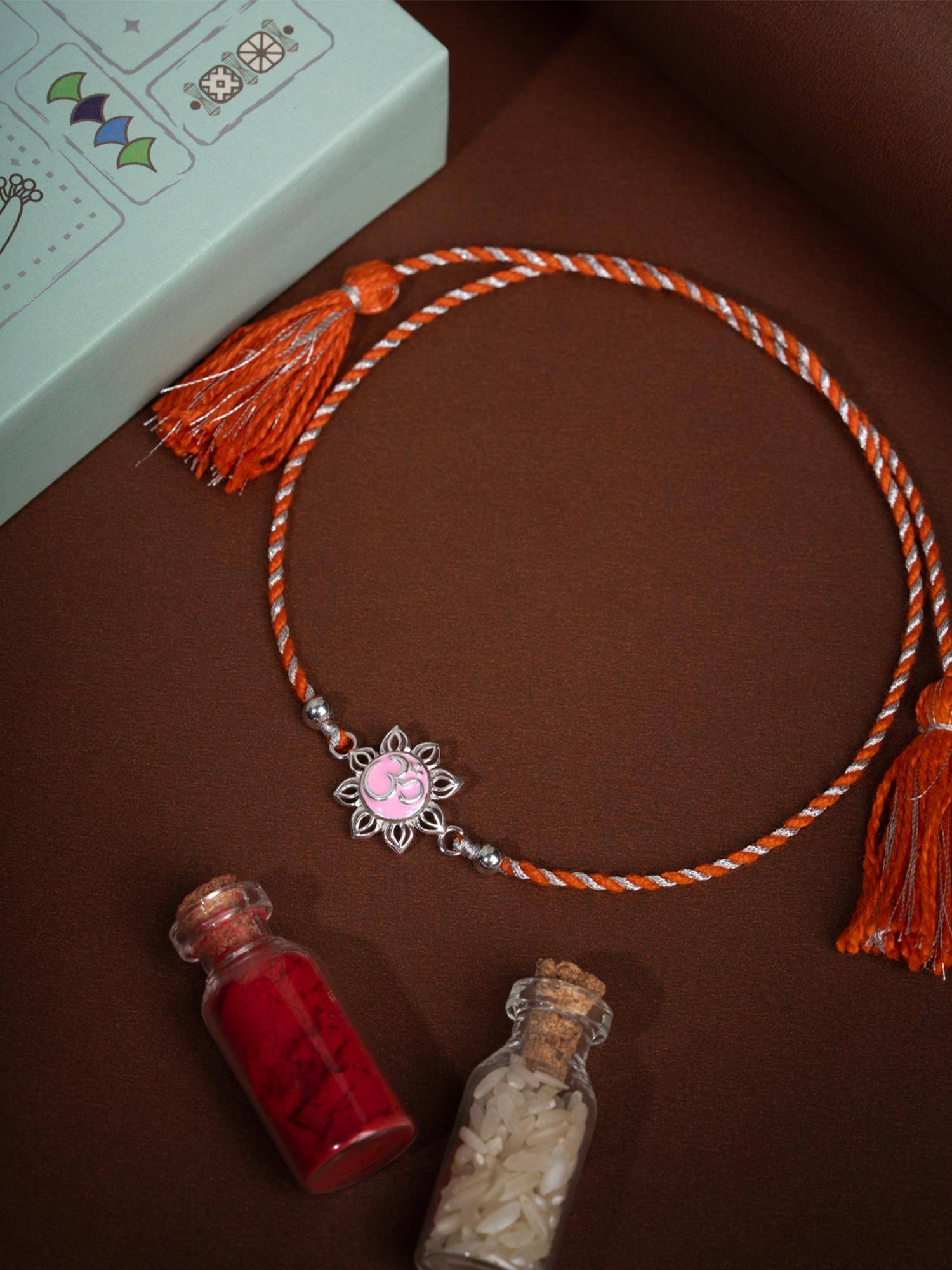 Shaya by CaratLane Om Pink Flower 925 Silver Rakhi