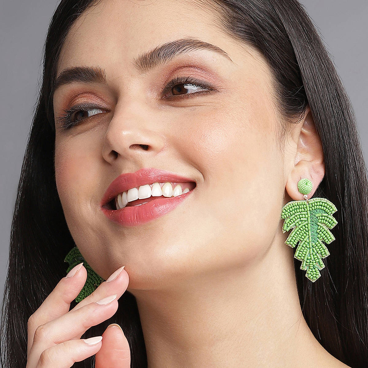 SOHI Green Beaded Leaf Shaped Earrings
