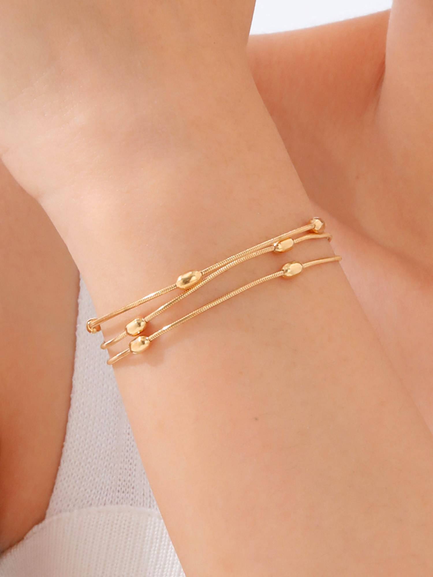 Jewels Galaxy Gold Plated Anti Tarnish Stainless Steel Triple Strand Bracelet