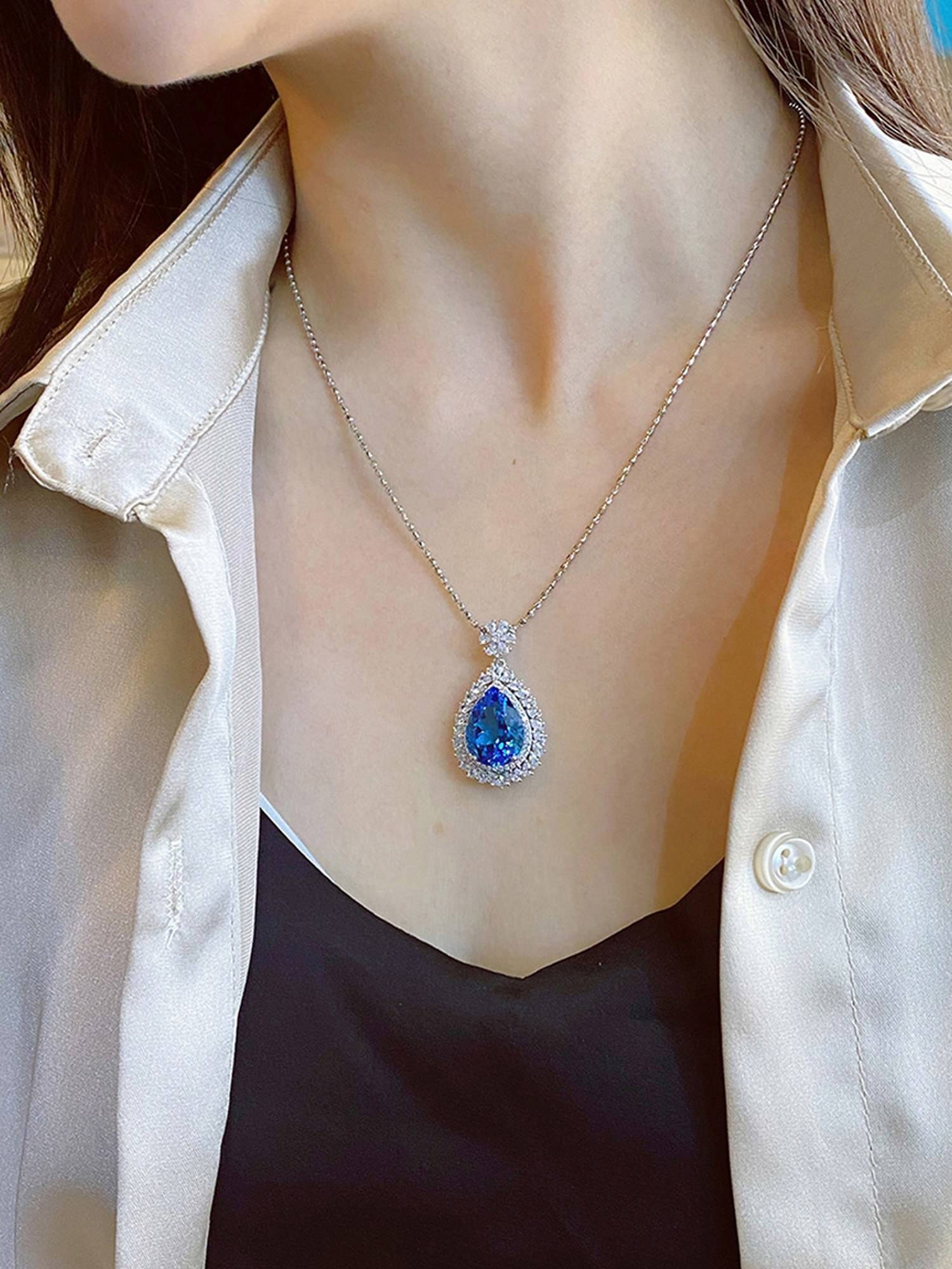Jewels Galaxy Silver Plated American Diamond Blue Teardrop Shape Pendant Necklace
