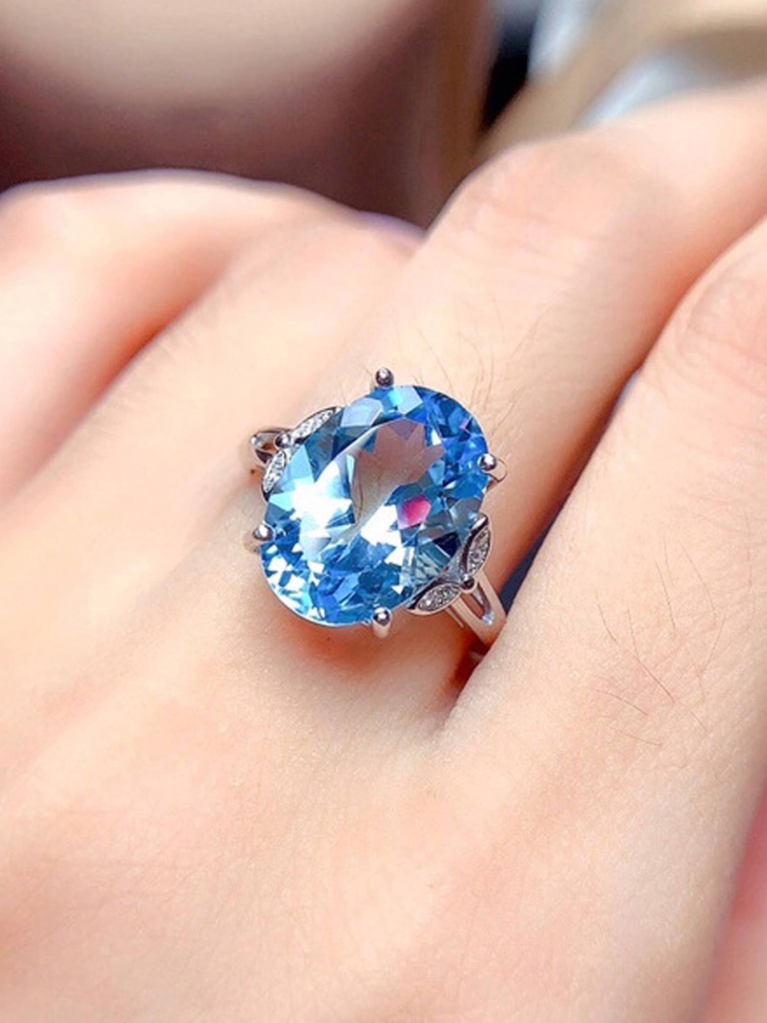 Jewels Galaxy Silver Plated American Diamond Crushed Ice Cut Blue Oval Finger Ring