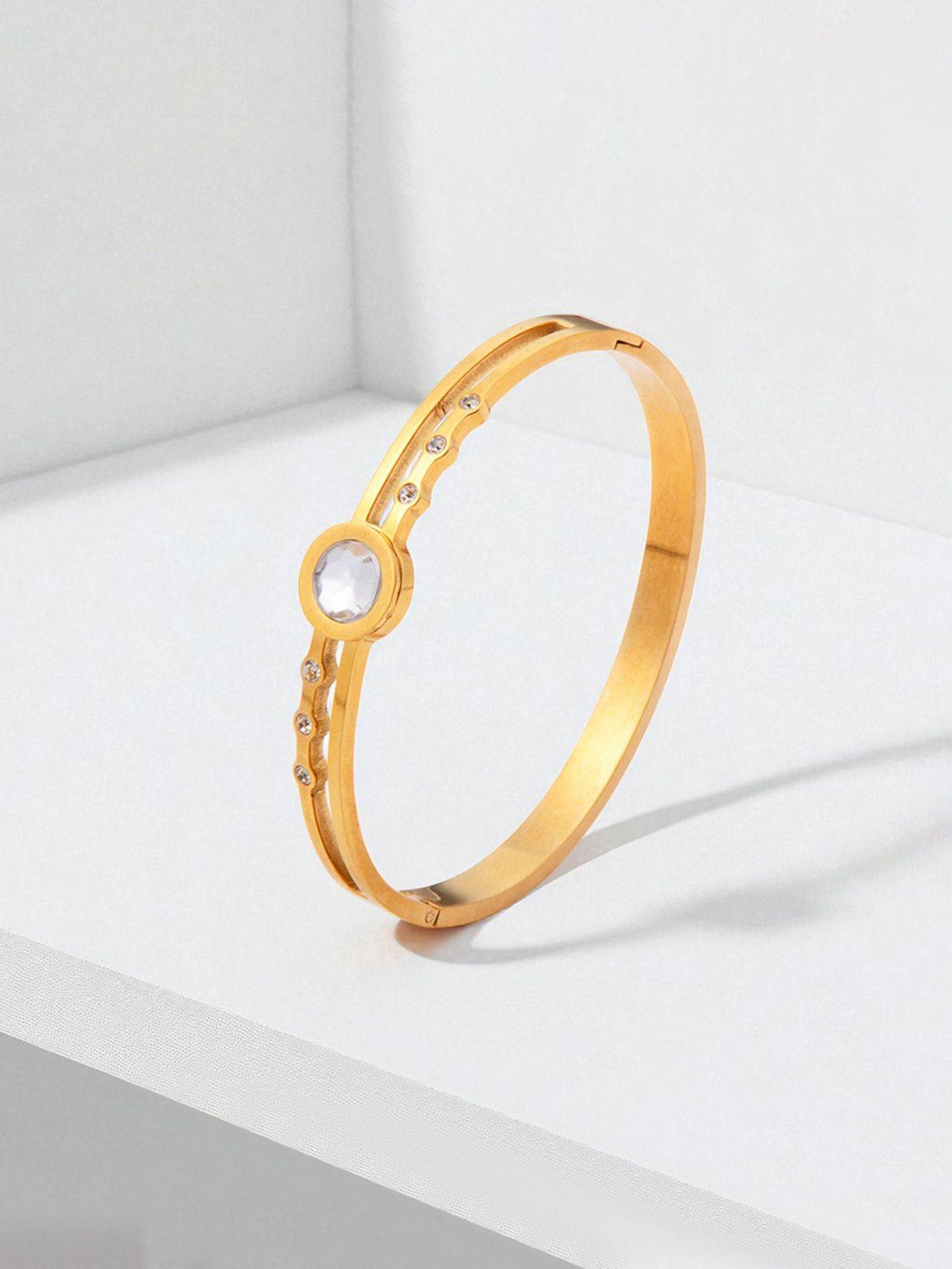 Jewels Galaxy Gold Plated Stainless Steel Stone Embedded Anti Tarnish Bangle Style Bracelet