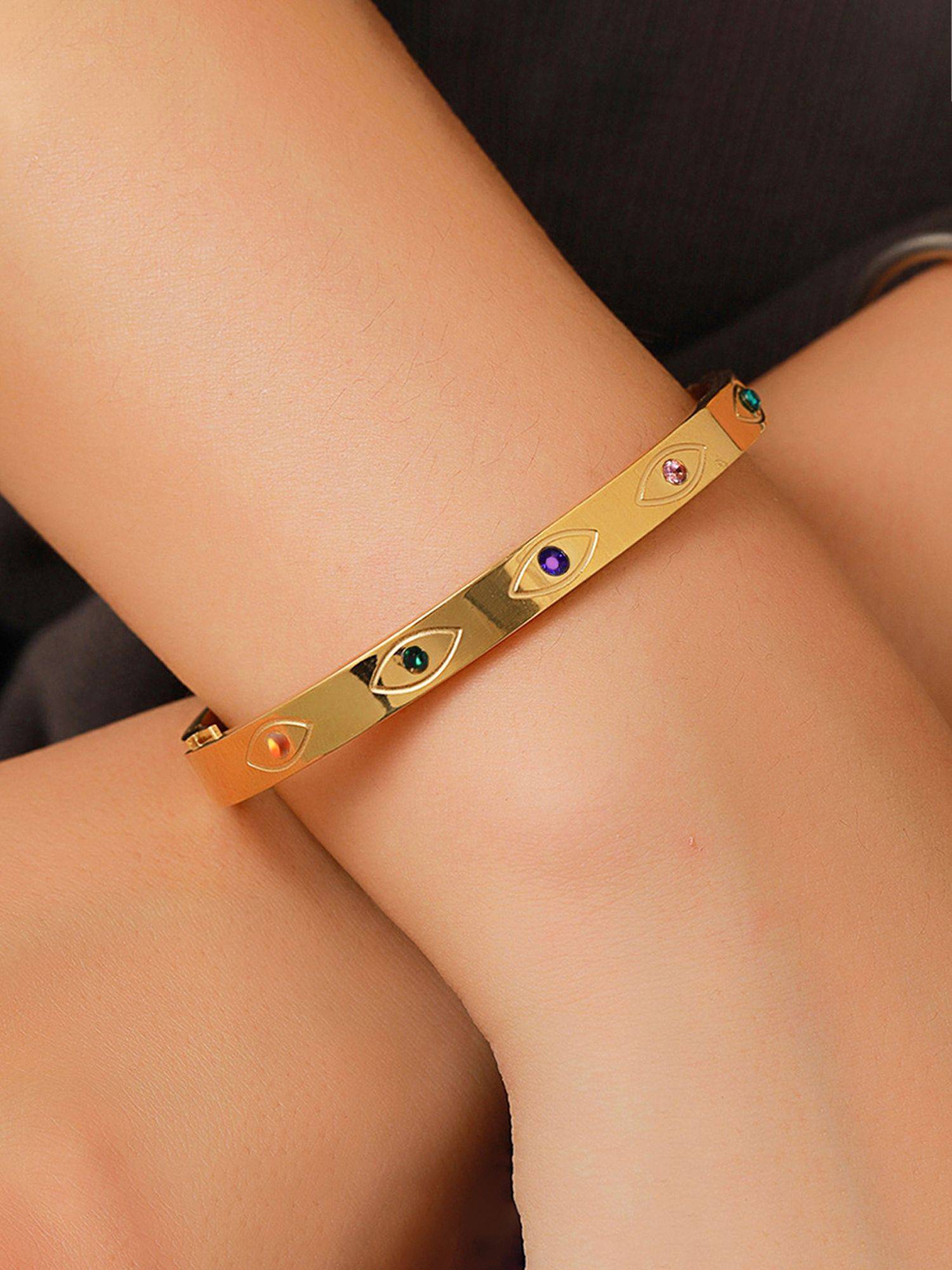Jewels Galaxy Gold Plated Stainless Steel Evil Eye Themed Anti Tarnish Bangle Style Bracelet