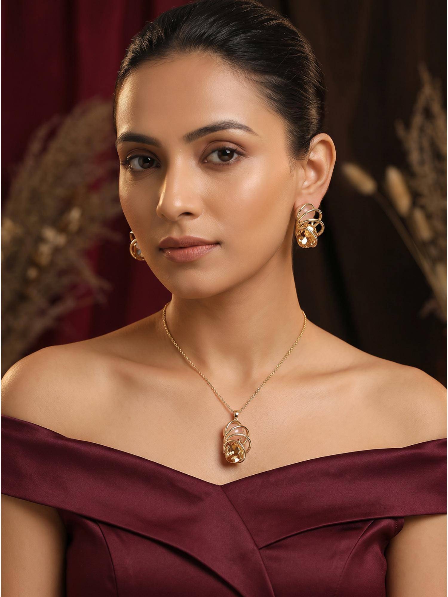 Saraf RS Jewellery Women 22k Gold Plated Amber Stone Spiral Cage Jewellery Set