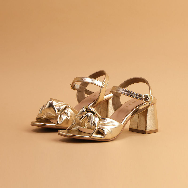 Gold ruffle top heels