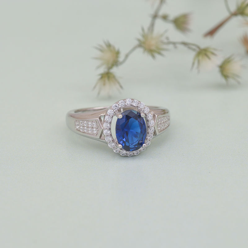 Ornate Jewels Aaa American Diamond Oval Shaped Simulated Blue Sapphire Halo Ring For Women - 397