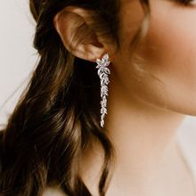 Yellow Chimes Silver-Toned and White Leaf Shaped Drop Earrings