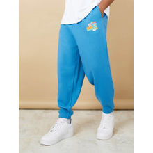 Styli Men Blue Cotton Oversized Graphic Badge Print Jogger