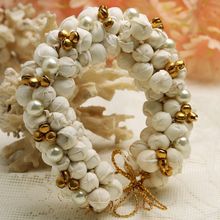 Moedbuille Off White Floral Design Gold Toned Beads Ghungroo and Pearls Handcrafted Hair Accessory