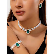 Peora Green Synthetic Stone Studded and White Pearl Jewellery Set